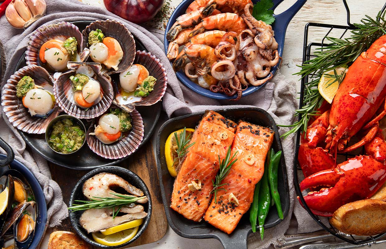 seafood dishes on a wooden table