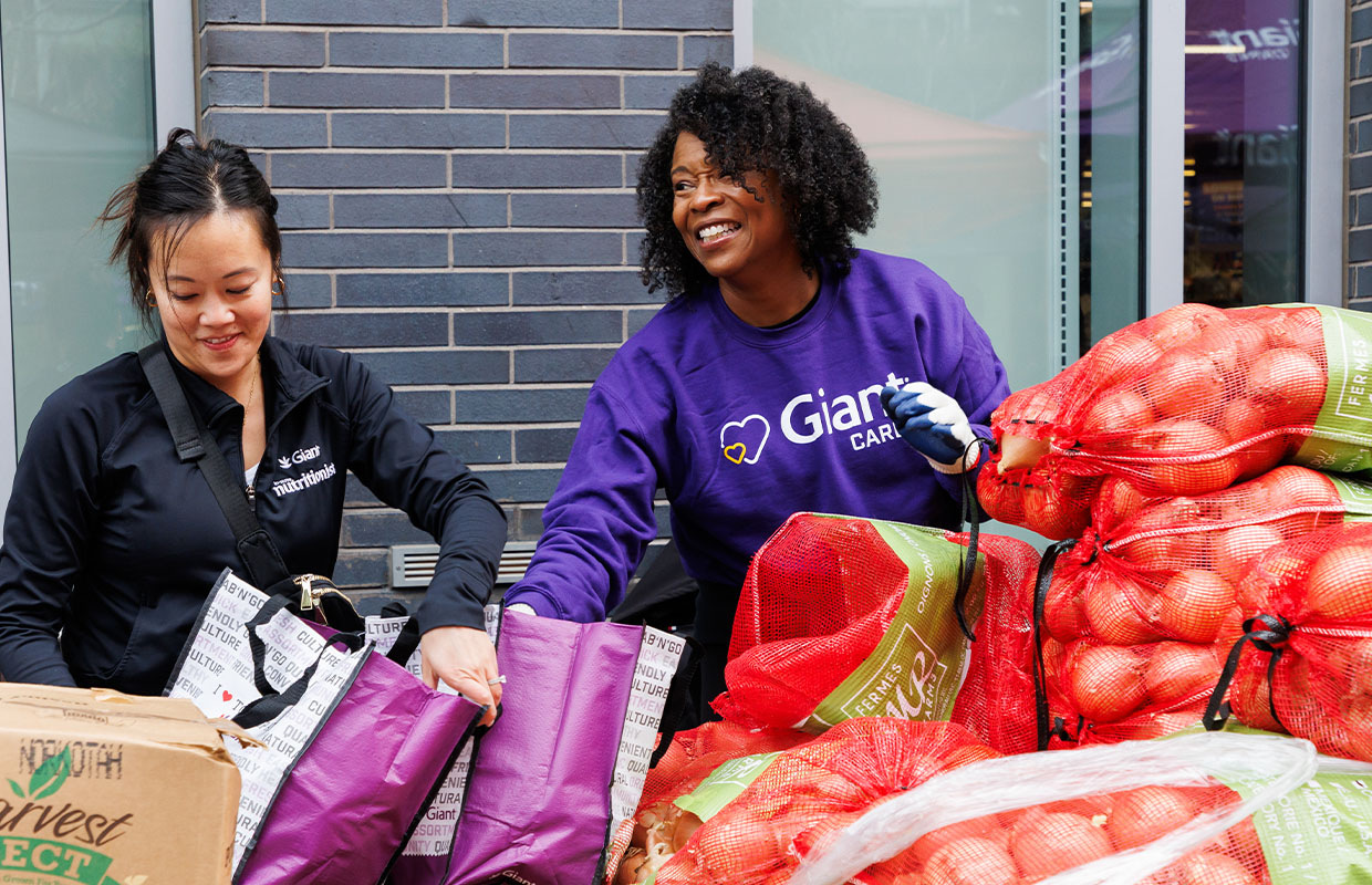Giant employees packing groceries
