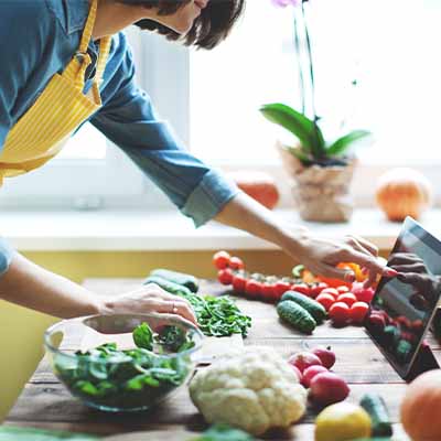 A woman cutting fresh produce
