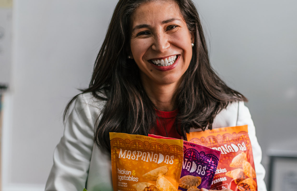 Owner of company holding bags of product