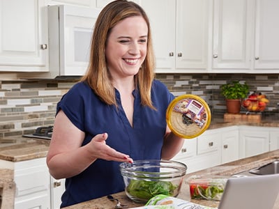 woman in the kitchen prepping a dish